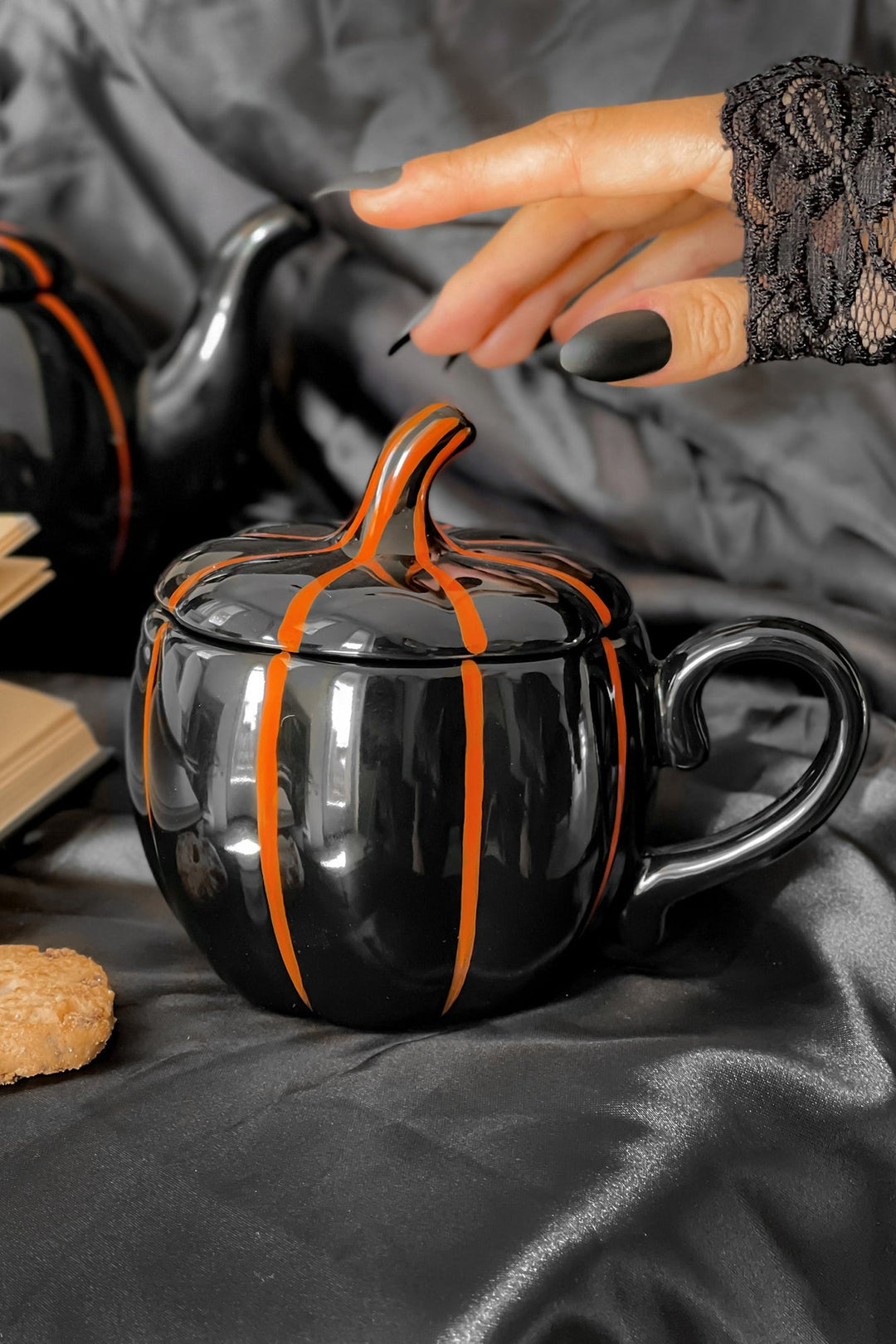 black ceramic pumpkin coffee cup