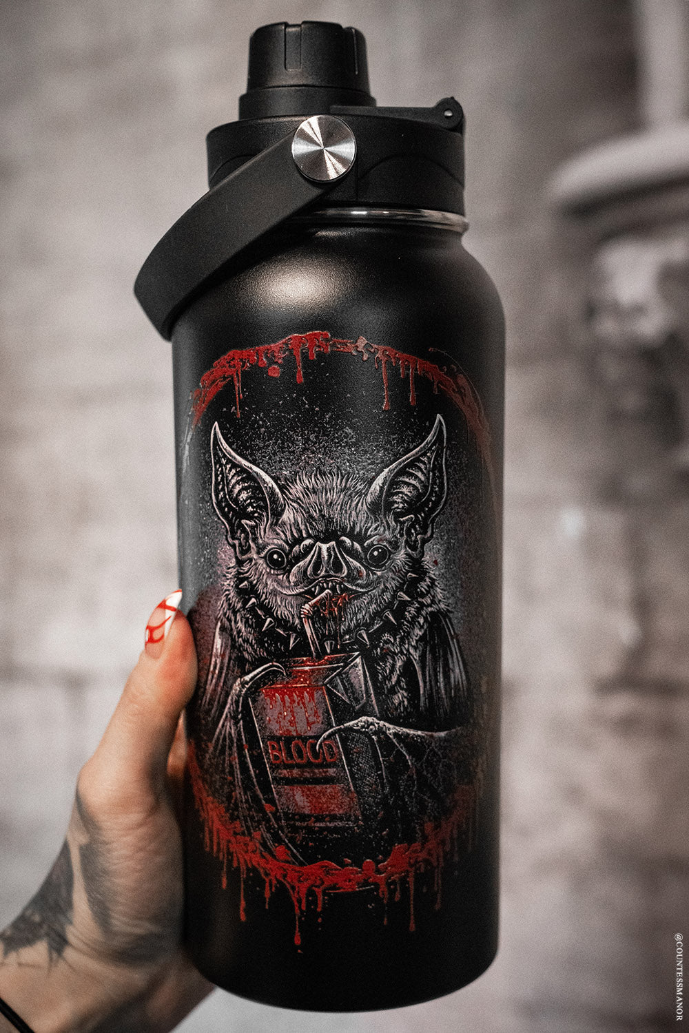 bat drinking a juice box of blood water bottle