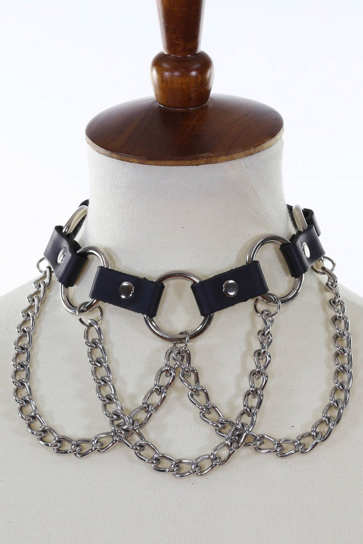 Black leather choker with silver chains on a mannequin head.