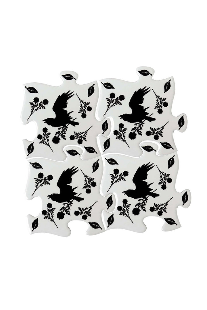 Set of black crow birds and leaf coasters on a white background