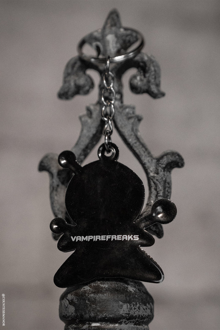 emo keychain with vampire freaks branding on the back
