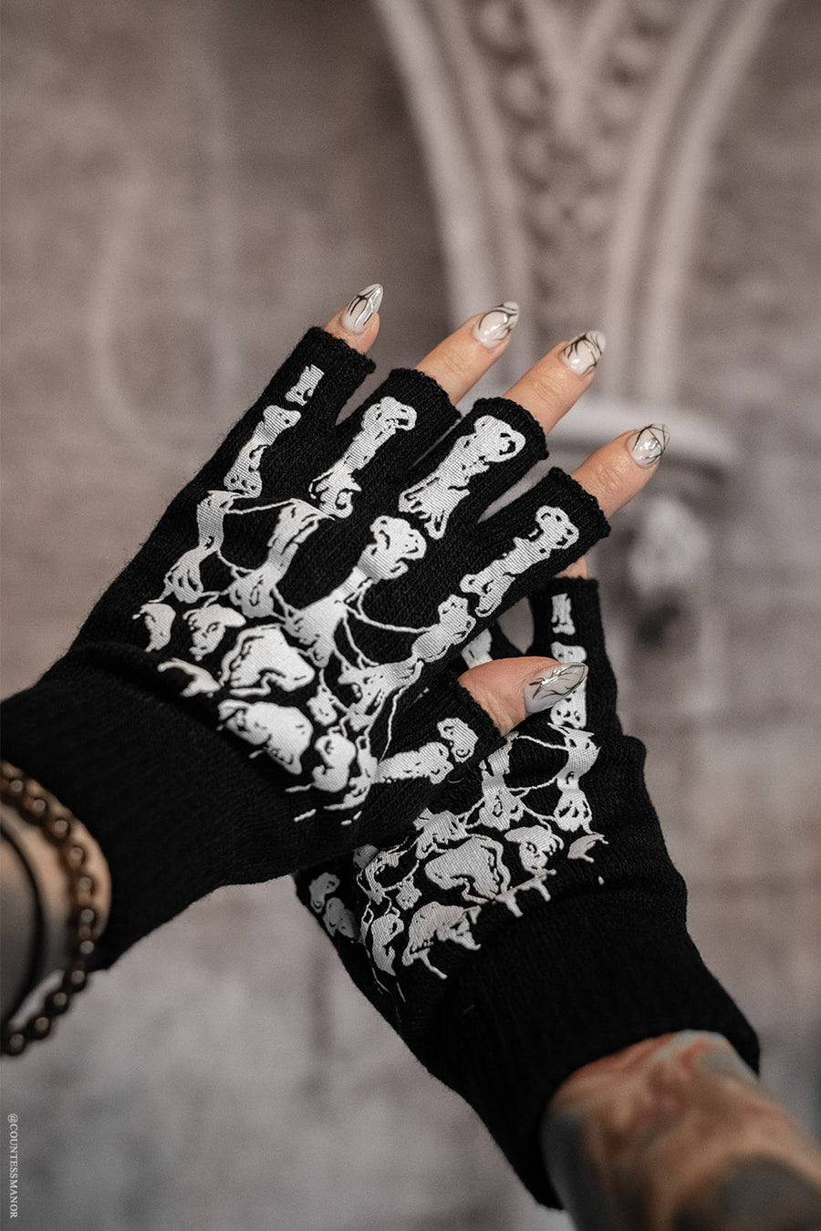 fingerless black knitted skeleton gloves