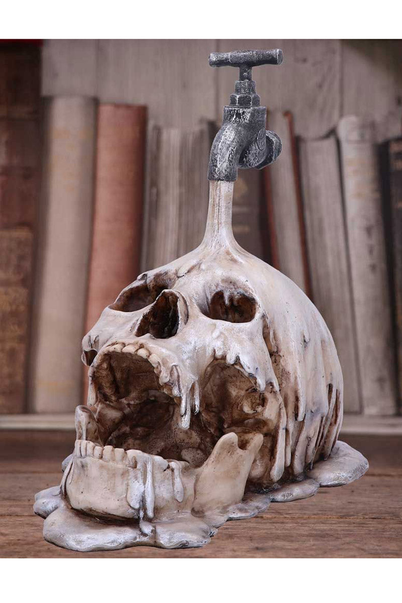 haunting human skull statue