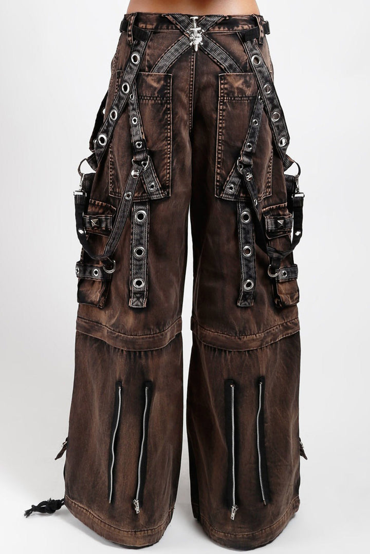 tripp NYC pants with eyelets, chain straps, and zippers