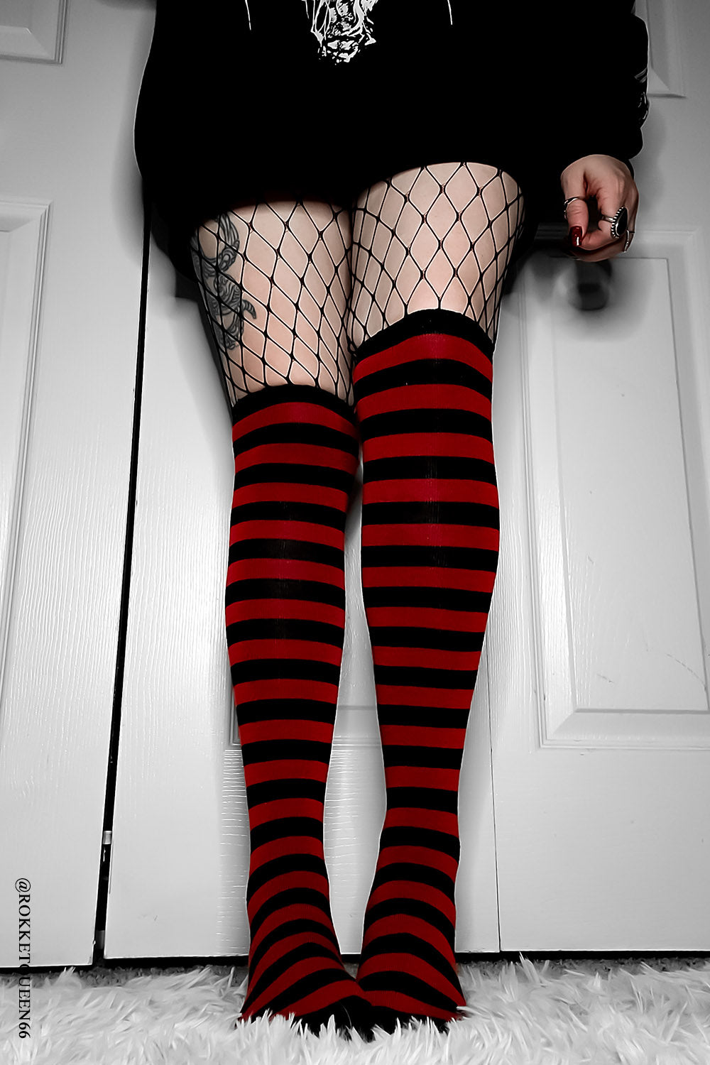 red and black striped socks with attached garter belts
