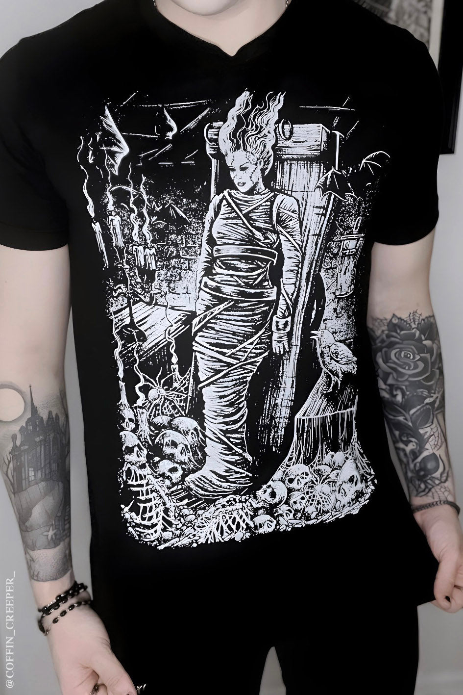 goth guy wearing tattoo inspired clothes