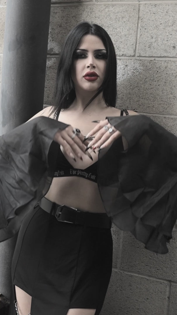 video of woman wearing vampire goth bell sleeve bolero