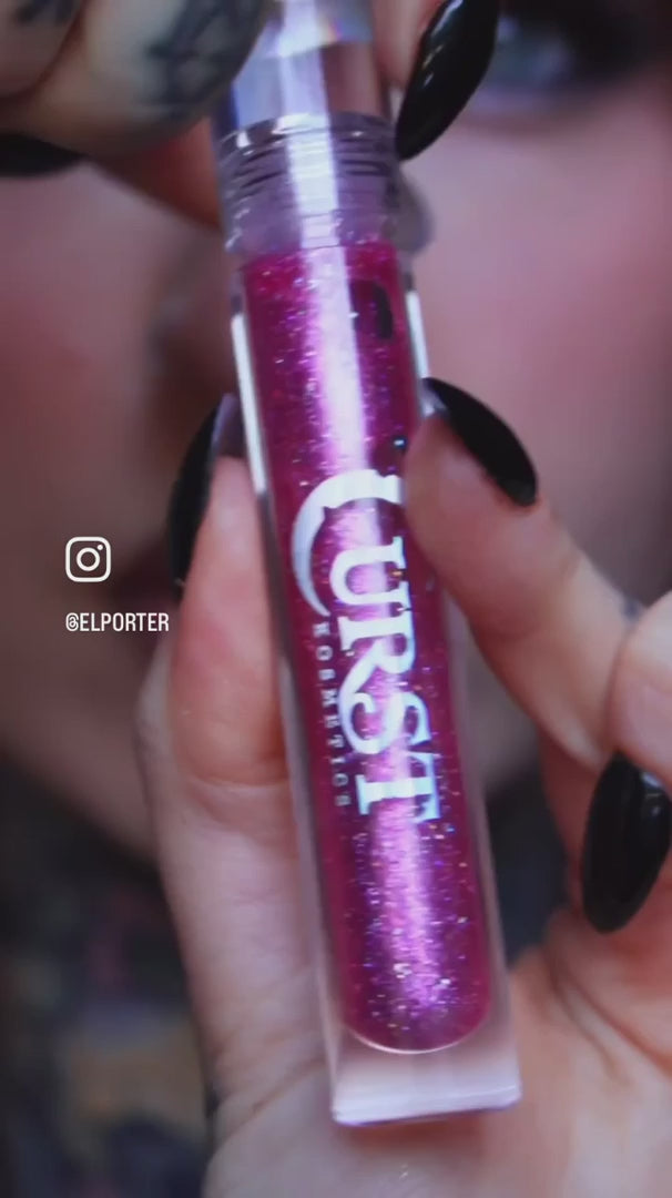 woman wearing pink glitter lip gloss