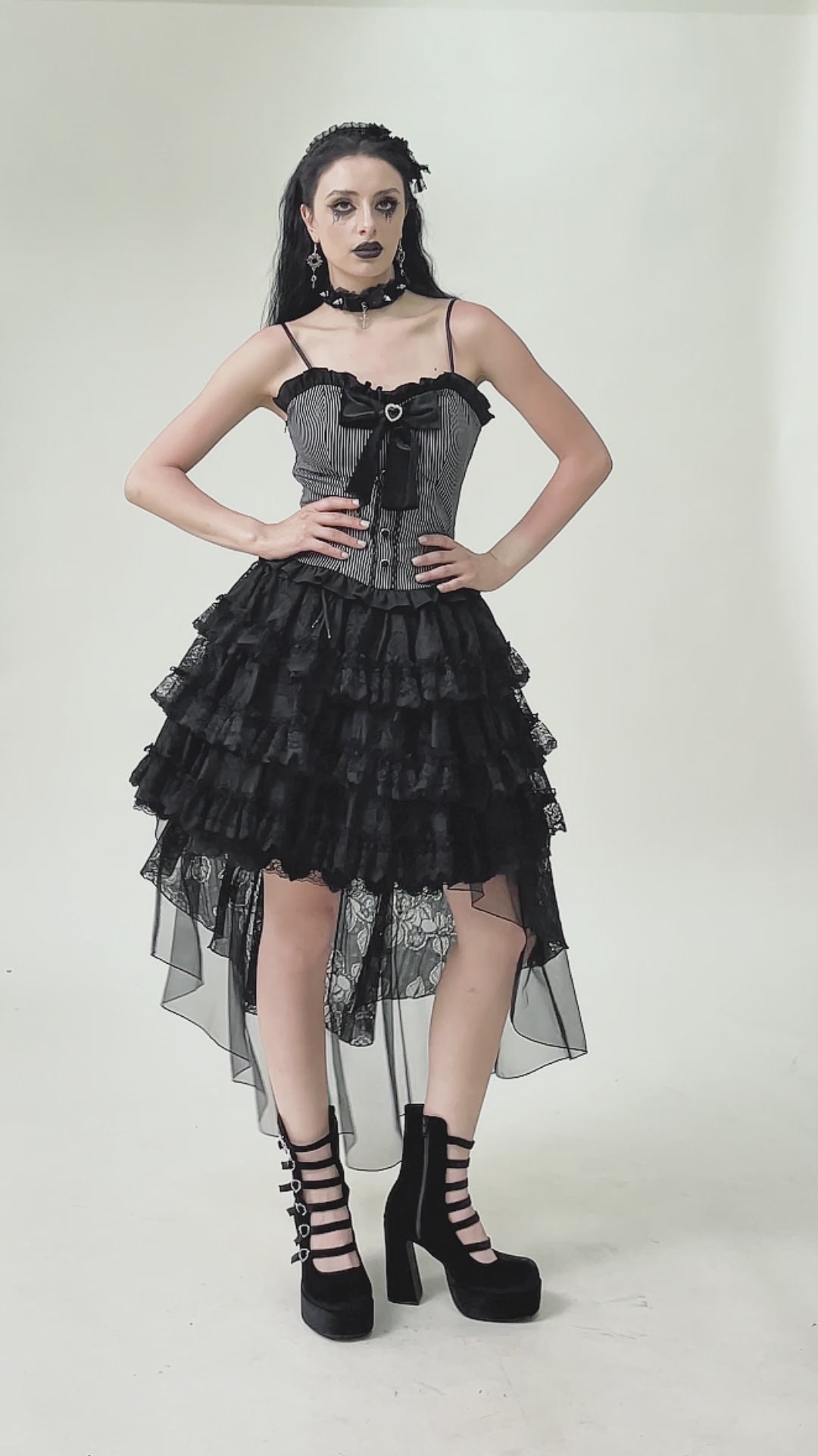 video of a gothic woman wearing a short to low lace ruffled skirt by dark in love
