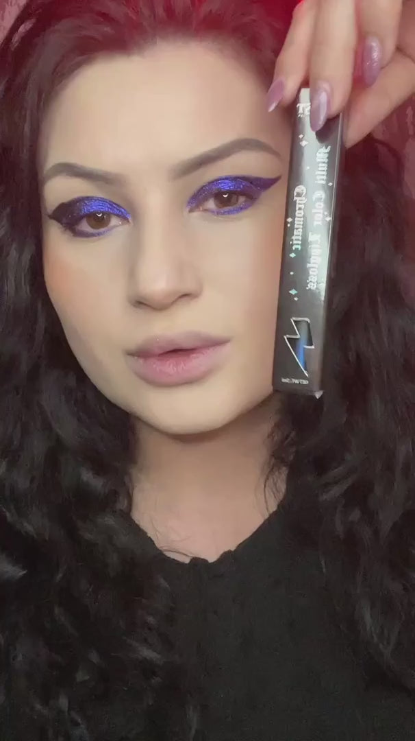 video of woman applying blue and purple lip gloss