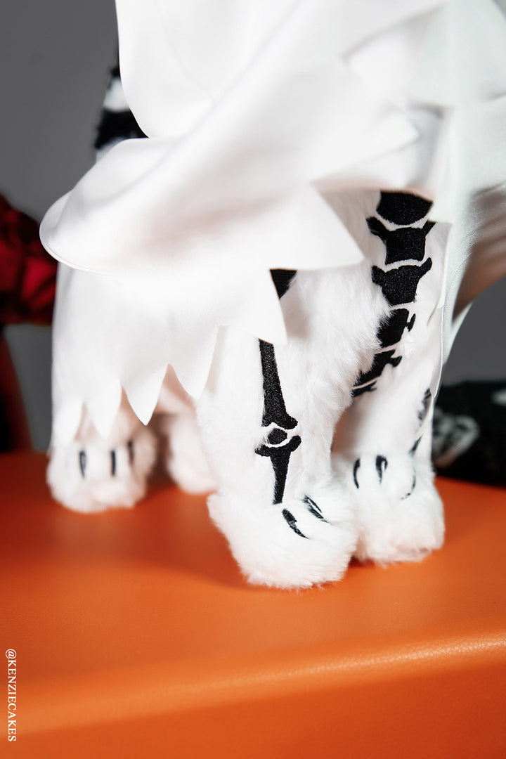 ghost cat plush toy with embroidered bones