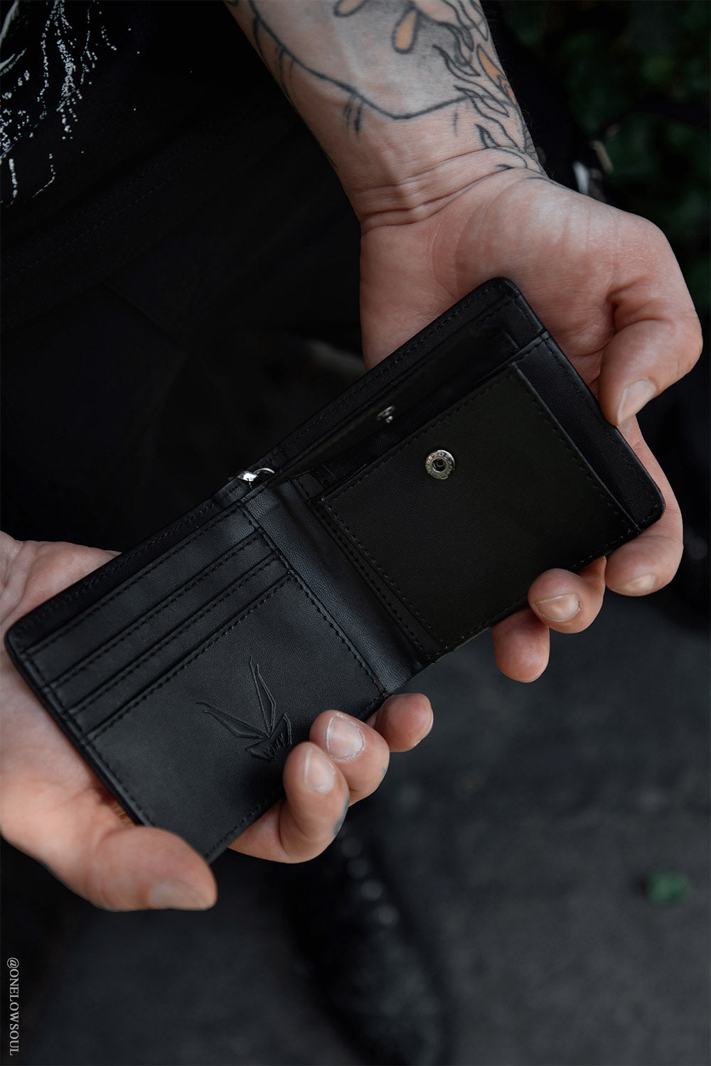 black vegan leather bi-fold wallet