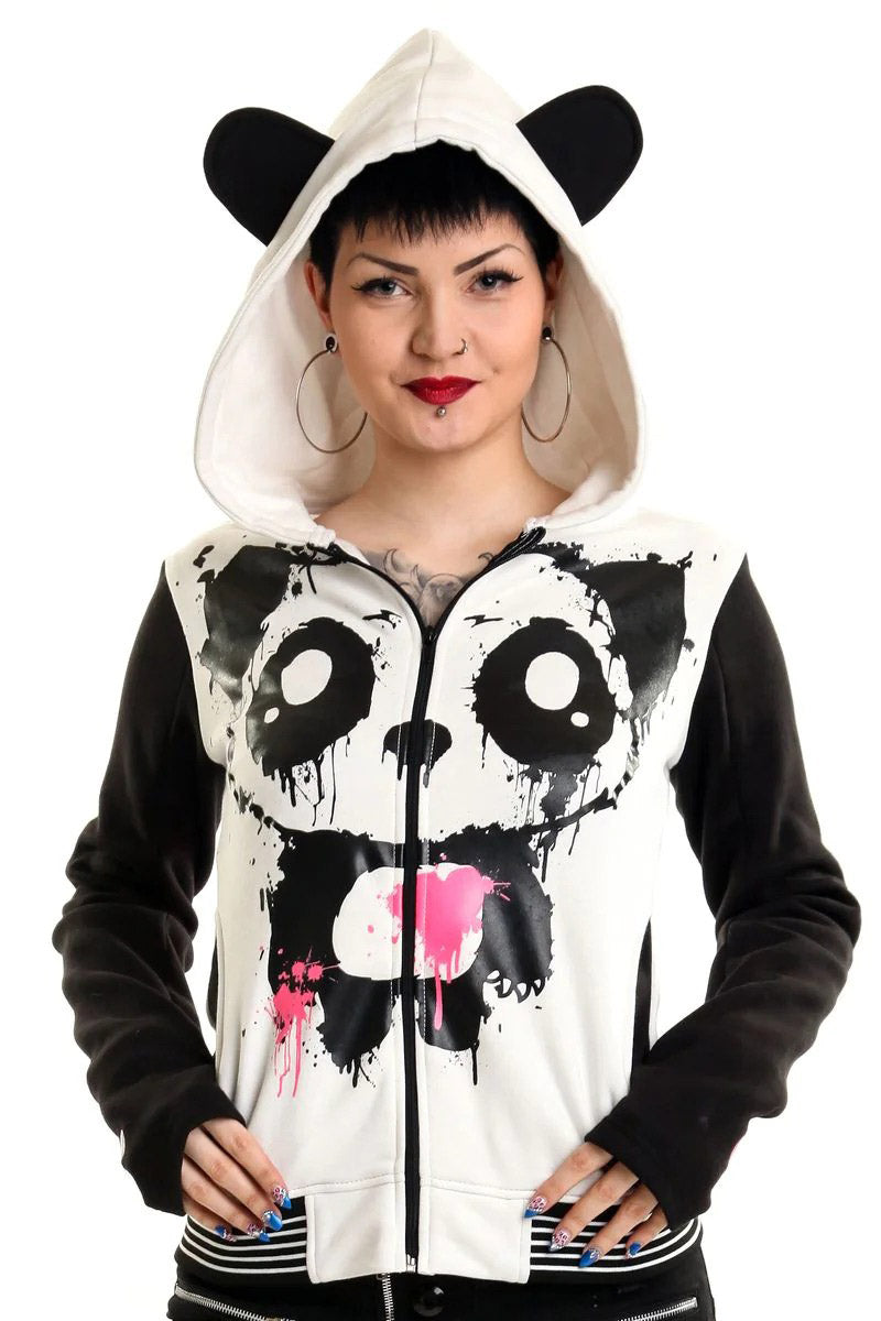 A woman wearing a hooded sweatshirt with a panda design, featuring black and white colors, and paw prints on the cuffs.