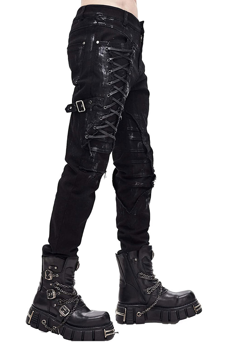 A pair of men's distressed black pants with lace-up accents and buckled leg harness, featuring back and front pockets and a zip fly with button close.