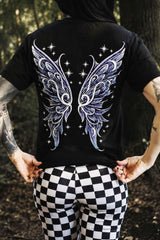Person wearing a black t-shirt with fairy wings design outdoors