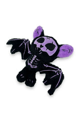 Black and purple skeleton plush toy with bat wings on a white background