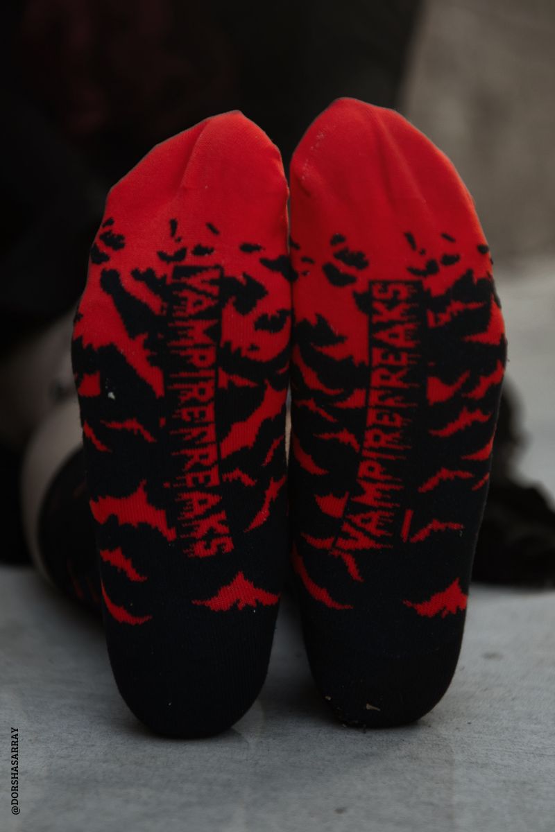 spooky black and red bat socks with vampirefreaks logo on the bottom 