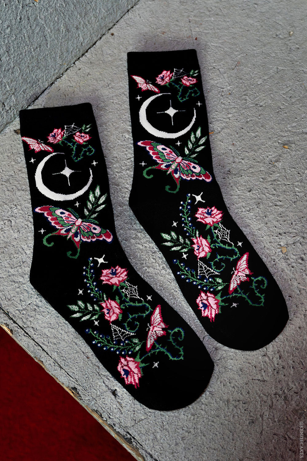 pink and green knitted witchy cottagecore moth and moon socks