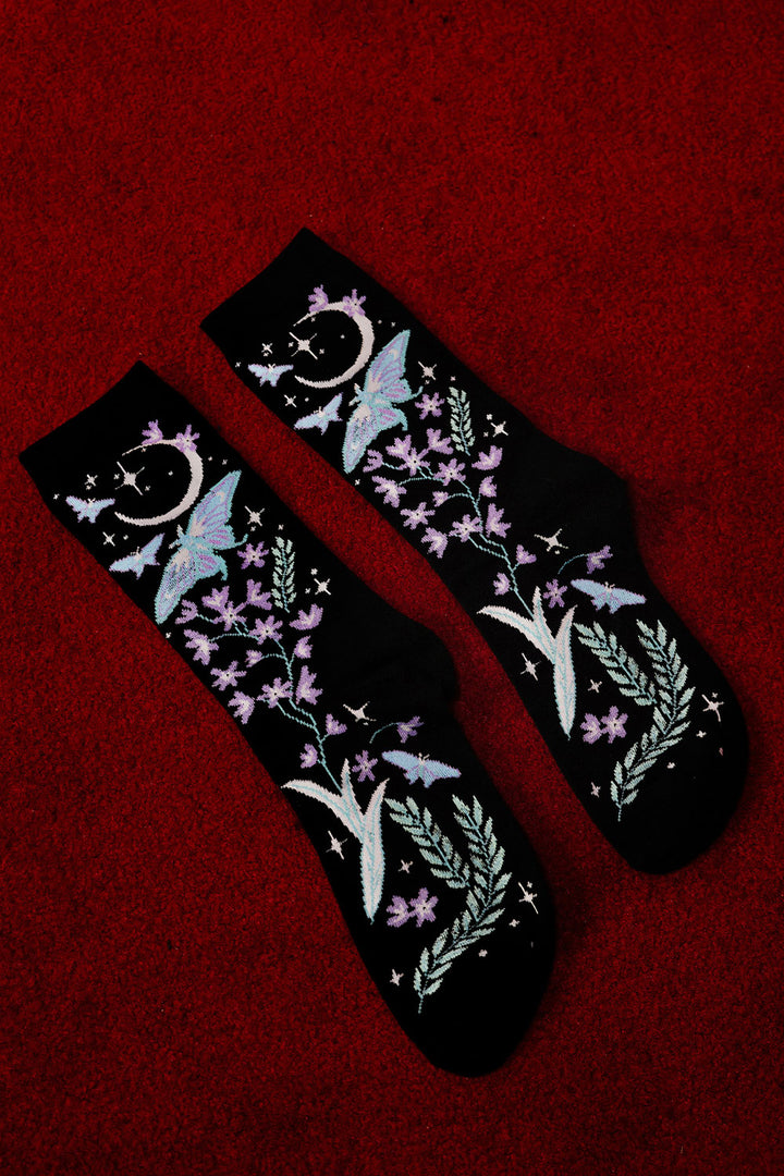 gothic enchanting knitted socks featuring moons, moths, and flowers