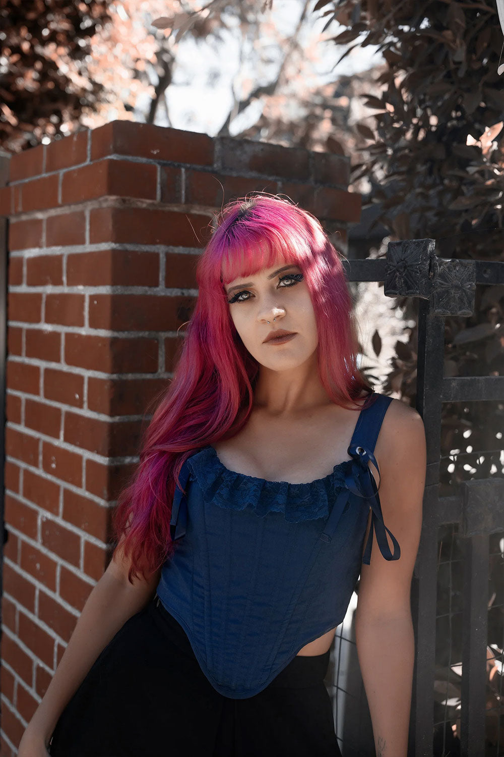 Corset with built-in boning structure, lace embellishment on neckline, satin webbing connection