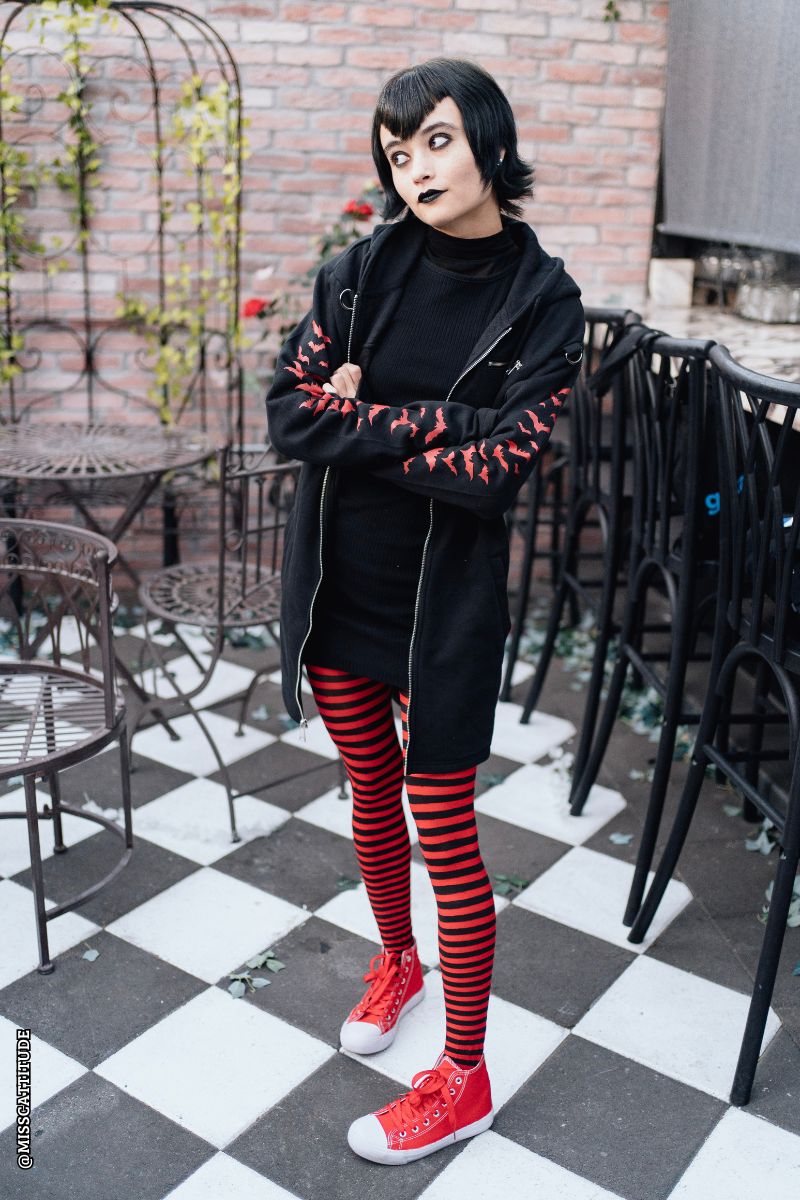 woman wearing a gothic hoodie with bat sleeves