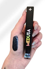 midnight blue, high-shine sparkle lip gloss loaded with dazzling, multi-dimensional glitter
