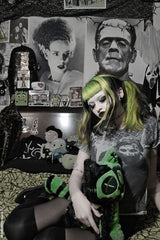 gothic girl holding a frankenstein cat plush stuffed animal 