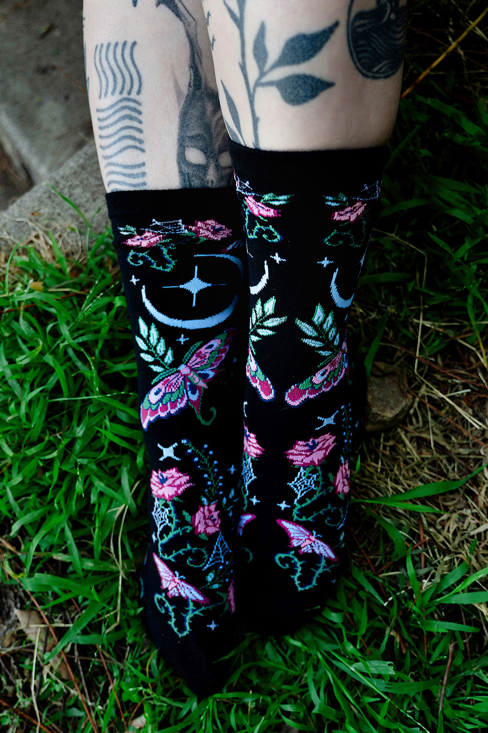 knitted witchy cottagecore moth and moon socks