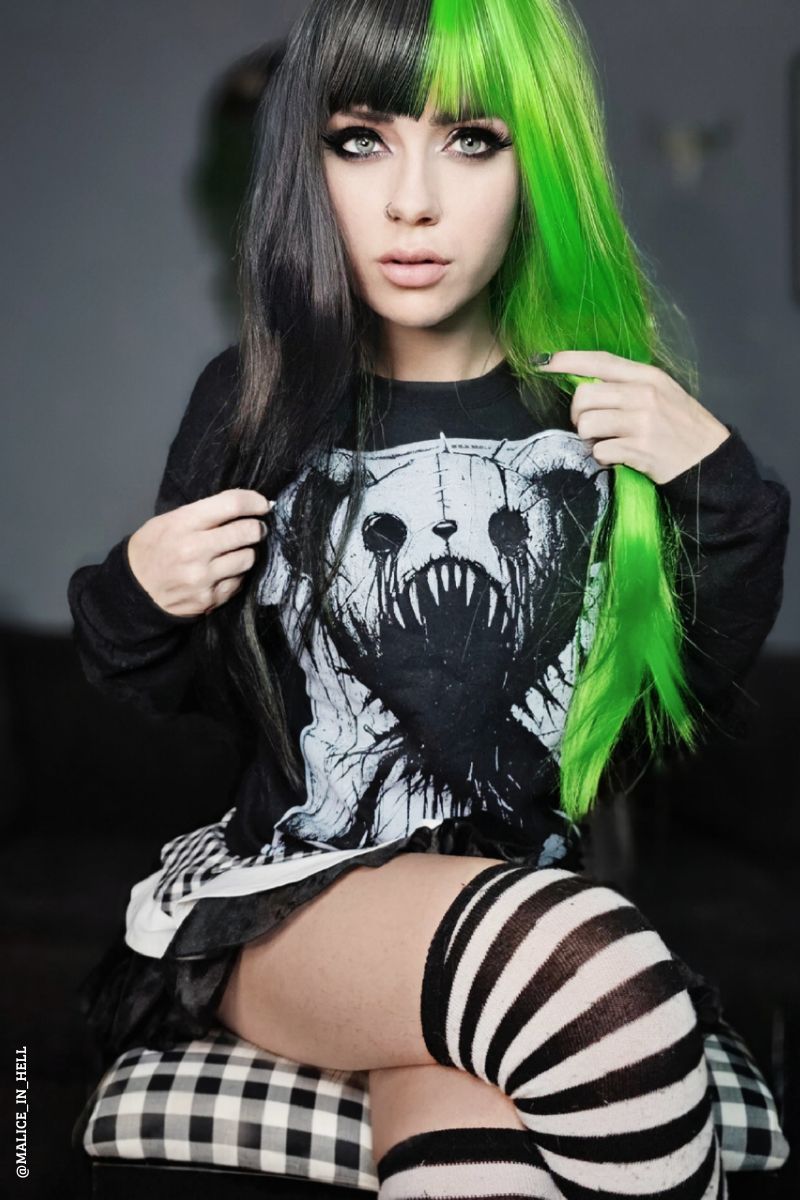 gothic woman with green hair wearing an emo heavy metal scary spooky teddy bear sweatshirt