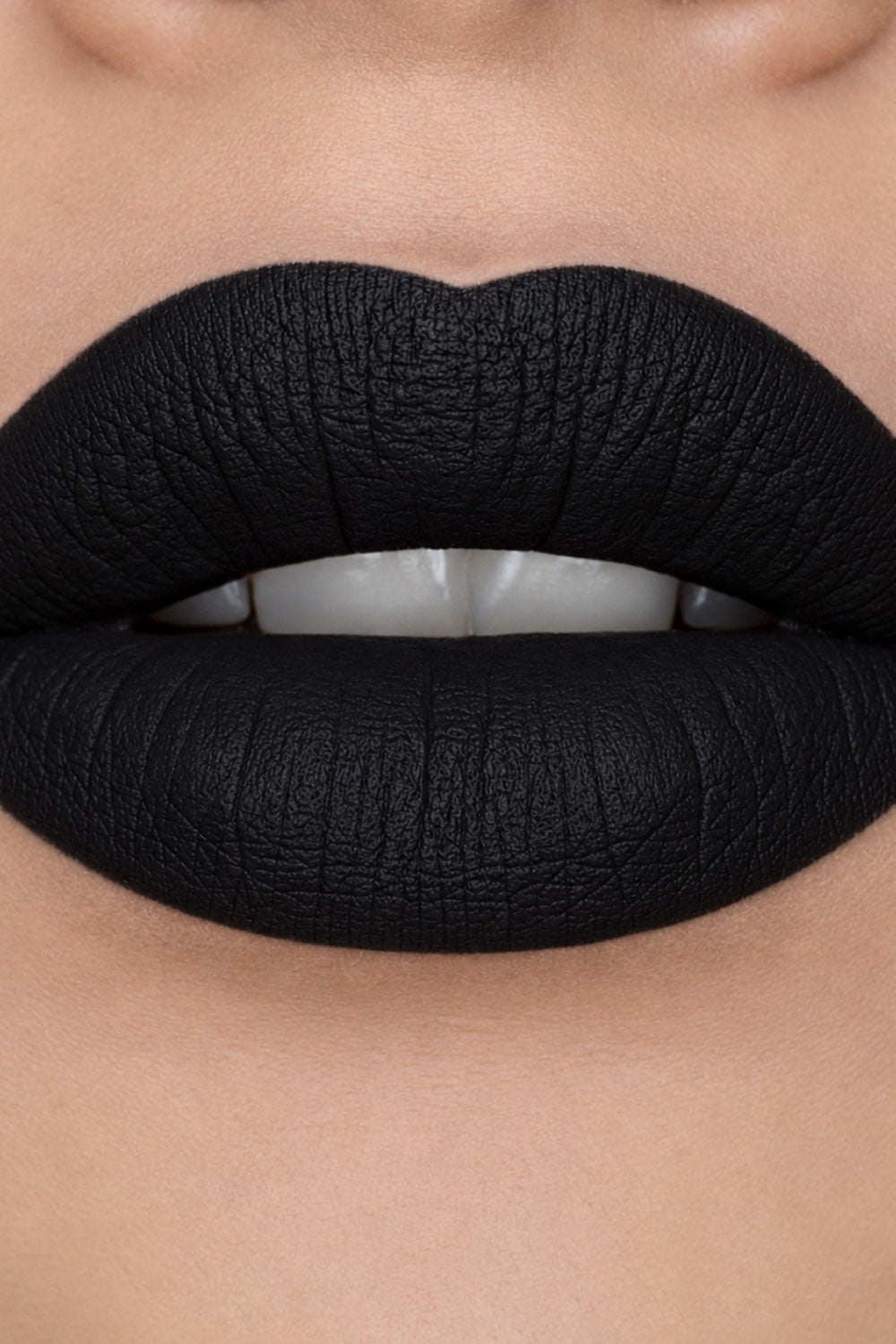 deep black punk grunge black lipstick in matte black lipstick tube with a magnetic closure