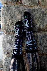 enchanting fairytale knitted socks featuring moons, moths, and flowers