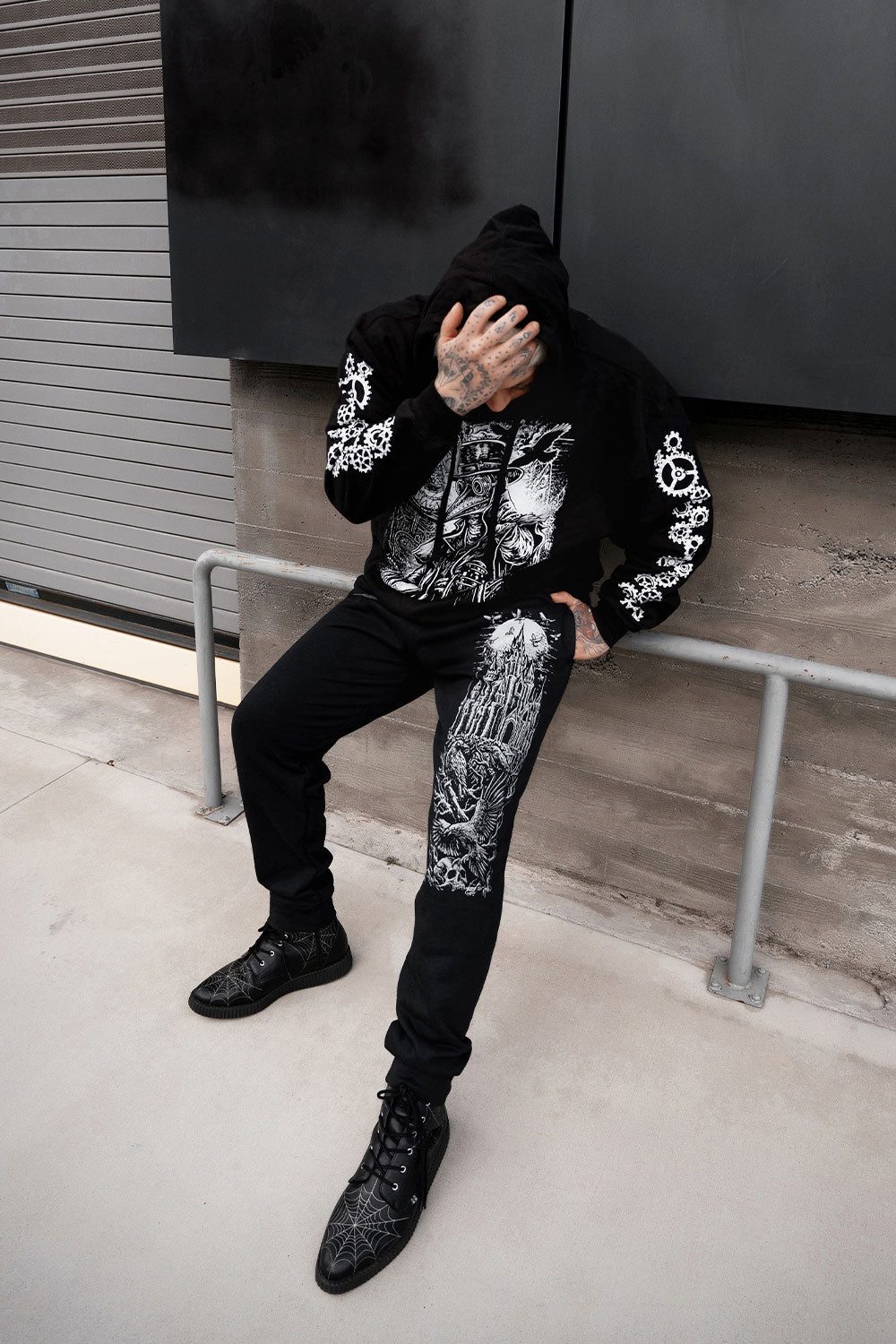 black cotton blended sweatpants with full moon and raven castle printed on them