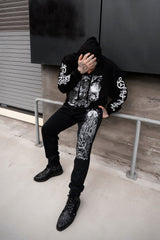 black cotton blended sweatpants with full moon and raven castle printed on them
