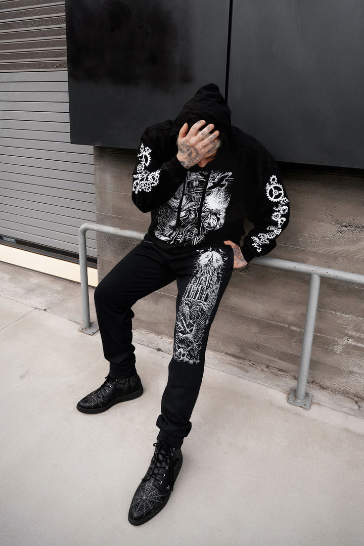 black cotton blended sweatpants with full moon and raven castle printed on them