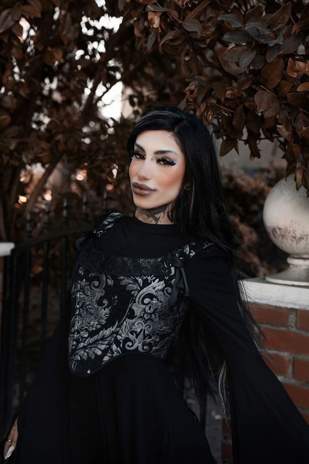 black corset with lace embellishment on neckline