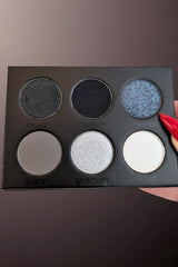 six-shade eyeshadow collection with rich mattes and luminous shimmers in classic black, gray, white, and cool neutrals