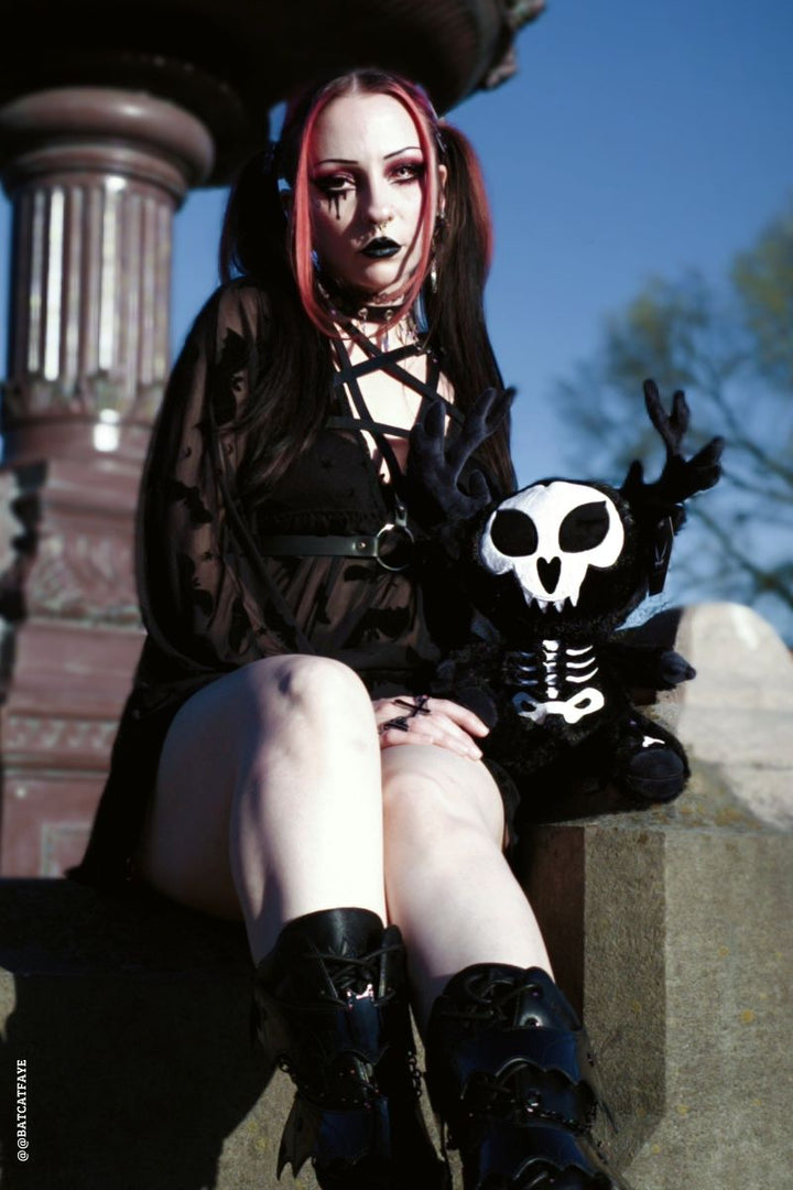 gothic girl and a skeleton wendigo cryptid plushie 