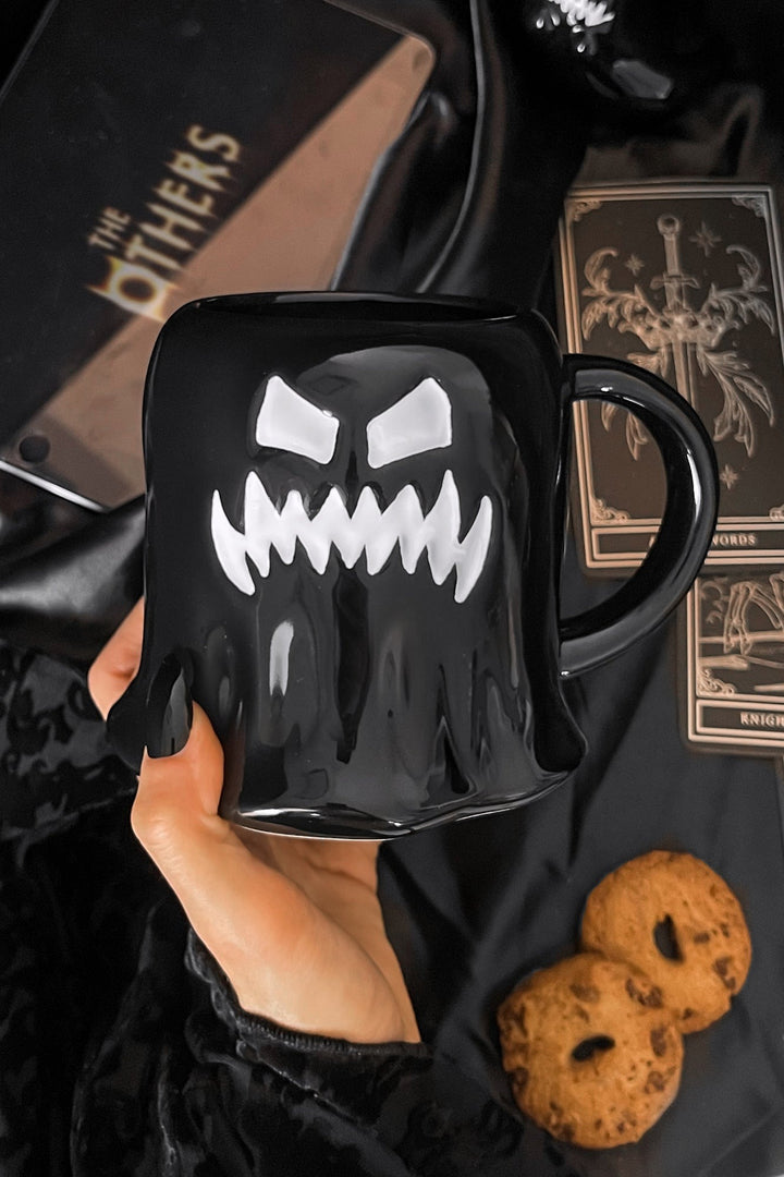 black ceramic ghost shaped coffee mug