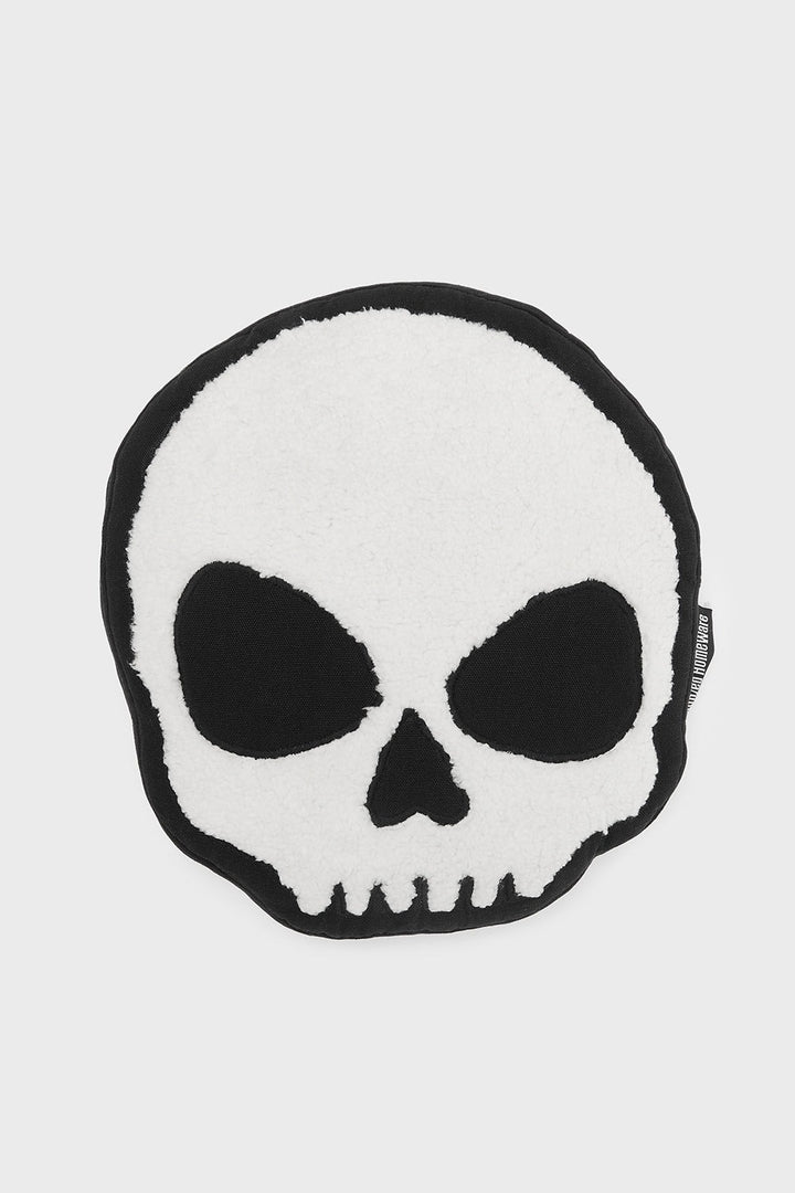 skull-shaped throw pillow