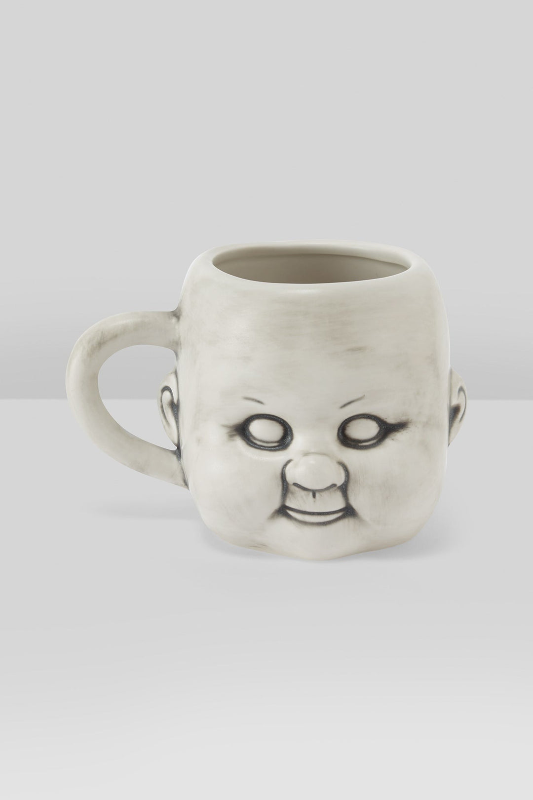 oddities doll head coffee cup