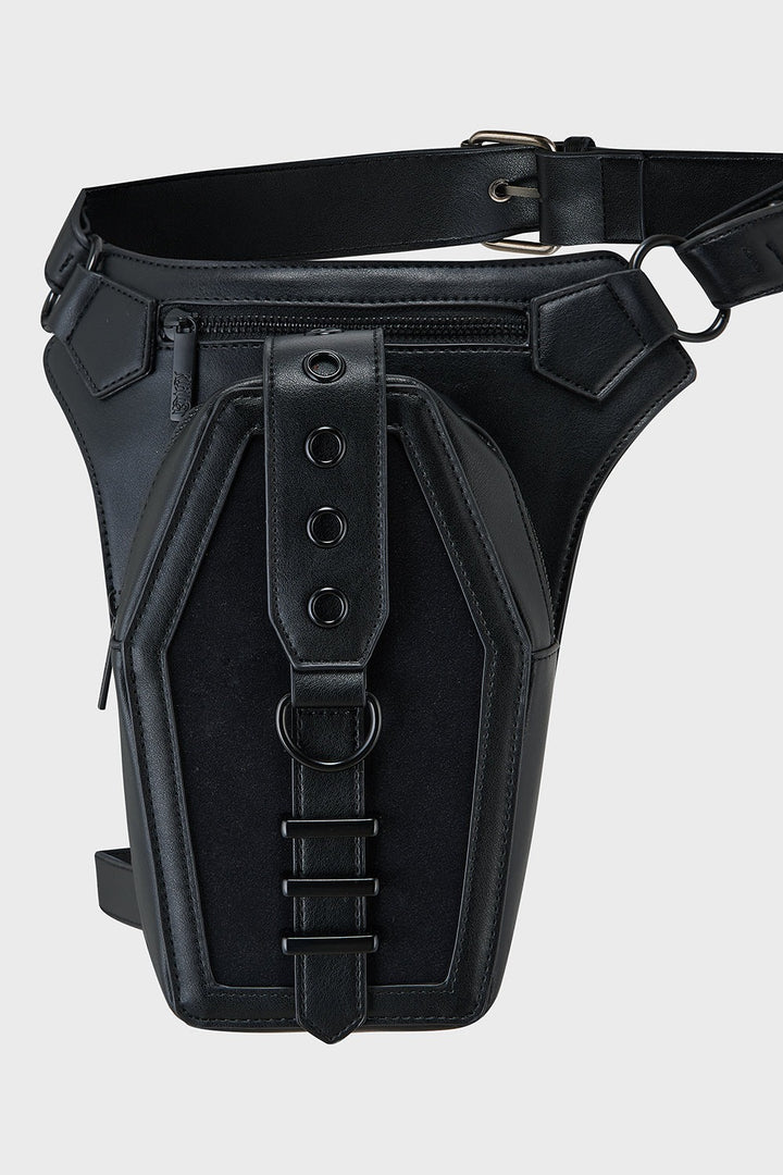 Black leather holster with belt on a light gray background