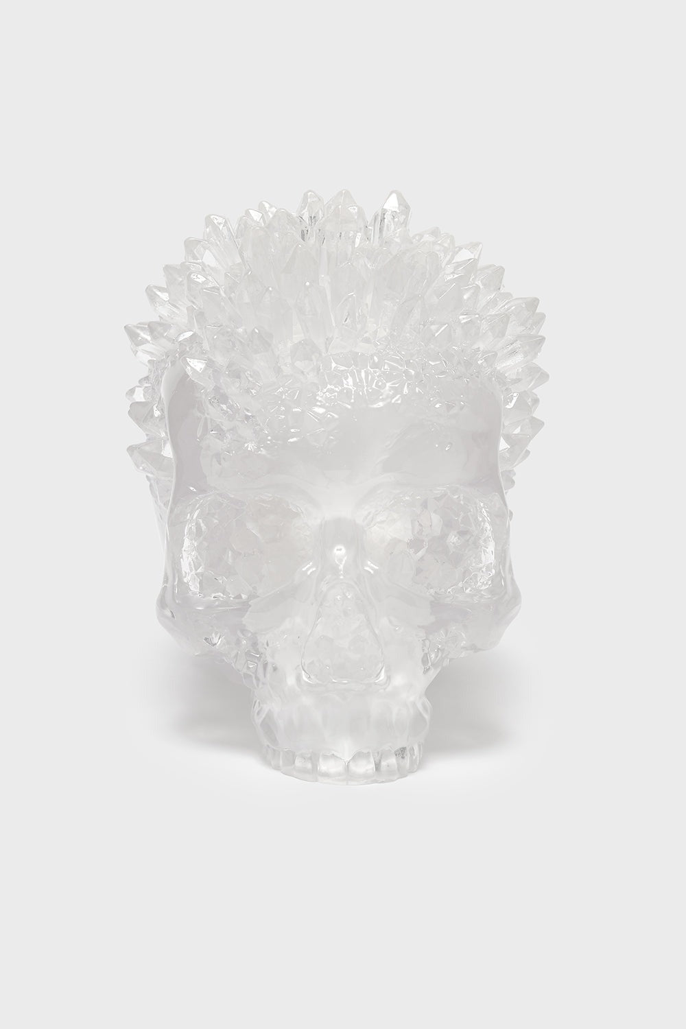 Clear skull statue on a white background by killstar