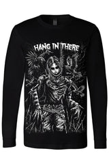 A black long-sleeve t-shirt featuring a large white graphic print of a skeletal figure with wings and the text 'HANG IN THERE' across the chest.