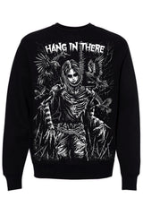 A black crewneck sweatshirt featuring a large white graphic print of a skeletal figure with wings and the text 'HANG IN THERE' across the chest, shown against a plain white background.