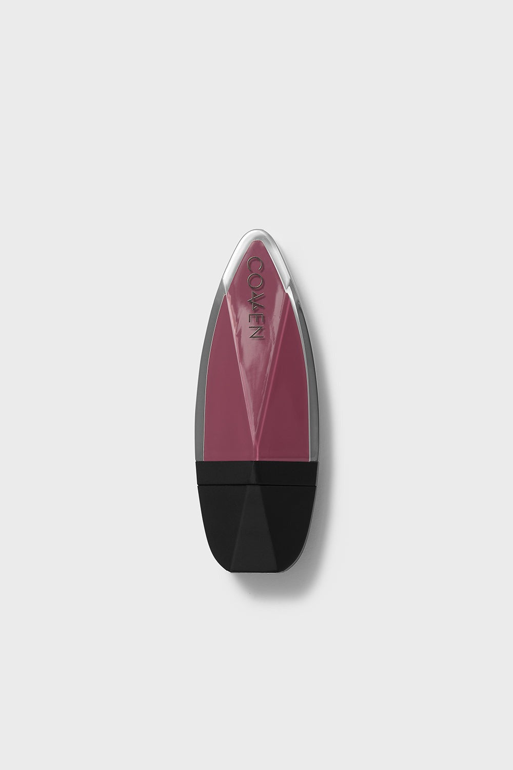 Lipstick with black base and pink shade on a light gray background