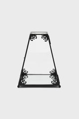 Decorative black metal terrarium case with intricate designs on a white background