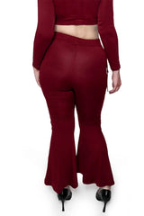 Back view of model wearing Oxblood Alice Flare Pants fromt Forest Ink