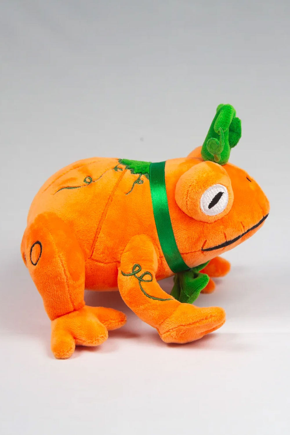 Orange pumpkin themed frog plush toy