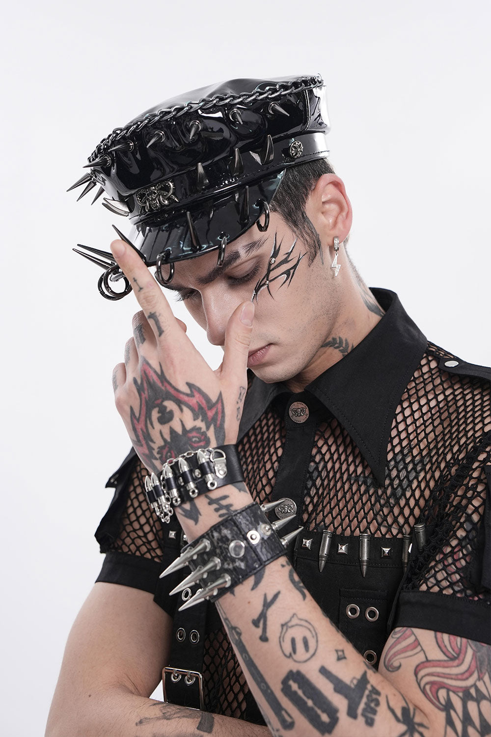 Model wearing faux leather pierced military style hat