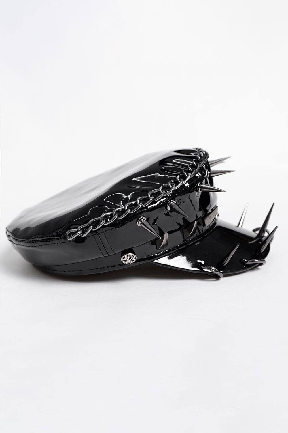 Side view of faux leather military style hat with chain detail